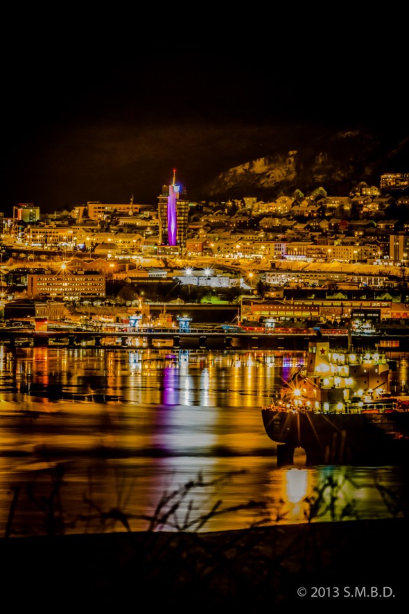 Sleepless in Narvik - The newly installed light show on the new hotel downtown reflects in the harbor basin.